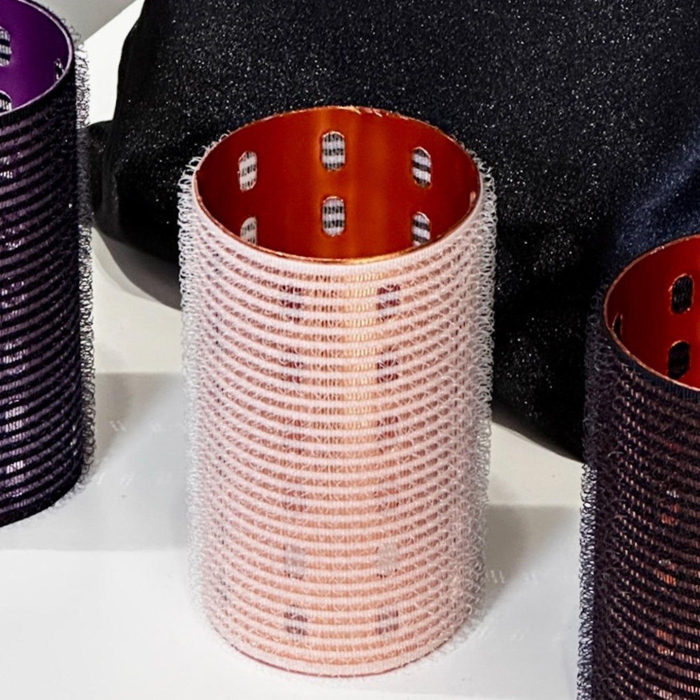 set of white volume rollers 